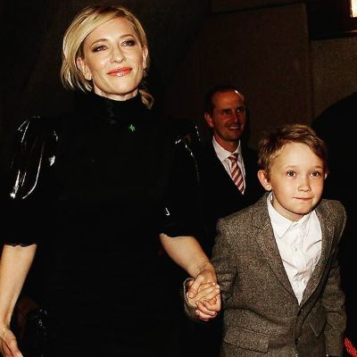 Cate Blanchett walking while holding hands with her eldest son Dashiell John Upton.